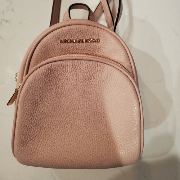 Michael Kors Handbags - NWOT Michael Kors mini backpack crossbody